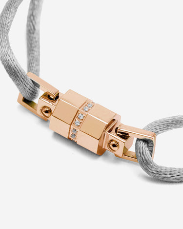 Midnight Lock Grijs Armband Rosè Goudkleurig, handgemaakt met luxe afwerking en sprankelende details.