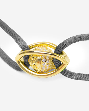 Emerald Guardian Grijze Armband met goudkleurig oog en zirconia, handgemaakte luxe sieraden