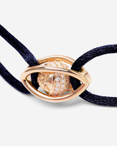 Emerald Guardian Donkerblauw Armband met Rosé Goudkleurig oog en zirconia steen, handgemaakte sieraden.