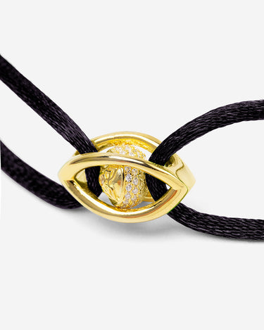 Emerald Guardian Goudkleurig Armband Zwart. Elegante armband met verfijnd gouden oog en zirconia steen.